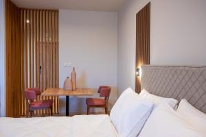 Postelja oz. postelje v sobi nastanitve KOSMAPOLITAN hotel