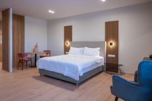 Postelja oz. postelje v sobi nastanitve KOSMAPOLITAN hotel