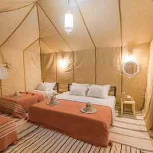 Ένα ή περισσότερα κρεβάτια σε δωμάτιο στο Safari trips Morocco luxury camp