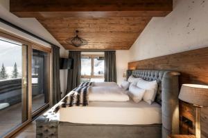 Katil atau katil-katil dalam bilik di DISTINCTIVE LUXURY DOLOMITI Apartments TERRE71 +117 gambar