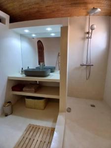 a bathroom with a sink and a mirror at Appartement Cascade in Saly Portudal +19 photos
