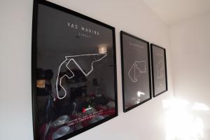 three framed pictures hanging on a wall at Harrods Flats in London +98 photos