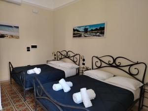 Posteľ alebo postele v izbe v ubytovaní Palazzo Castellano