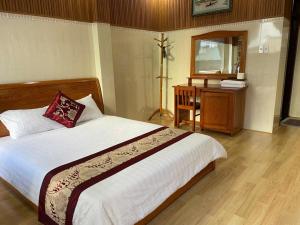 Postelja oz. postelje v sobi nastanitve New Sleep in Dalat Hostel