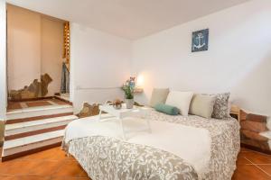 Ένα ή περισσότερα κρεβάτια σε δωμάτιο στο Villa Claudia - Calasetta