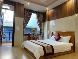 Postelja oz. postelje v sobi nastanitve New Sleep in Dalat Hostel