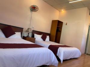 Postelja oz. postelje v sobi nastanitve New Sleep in Dalat Hostel