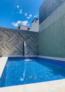 Πισίνα στο ή κοντά στο Casa próxima a praia com piscina! +17 φωτογραφίες