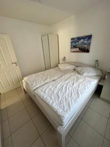 Postel nebo postele na pokoji v ubytování Heimathafen