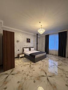 Postel nebo postele na pokoji v ubytování Mirvarim Hotel