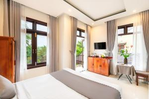 TV a/nebo společenská místnost v ubytování Phuoc Dat Riverside Homestay Hoi An