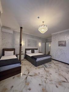 Postel nebo postele na pokoji v ubytování Mirvarim Hotel
