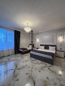 Postel nebo postele na pokoji v ubytování Mirvarim Hotel