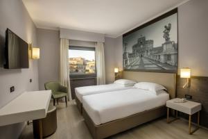 Postelja oz. postelje v sobi nastanitve Hotel Marc'Aurelio