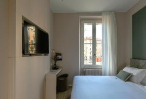 Postel nebo postele na pokoji v ubytování Aiello Hotels - Isola Design District