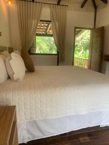 Cama ou camas em um quarto em Pousada Rancho Soberbo, Serra do Cipó
