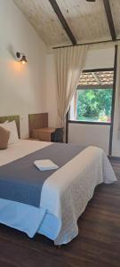 Cama ou camas em um quarto em Pousada Rancho Soberbo, Serra do Cipó