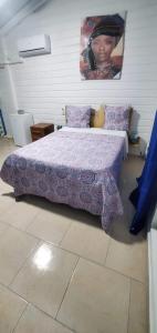 Postel nebo postele na pokoji v ubytování les gîtes de la belle fleur bungalow TULIPE