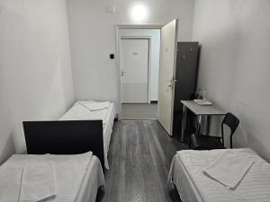 Posteľ alebo postele v izbe v ubytovaní Dominik Panzió