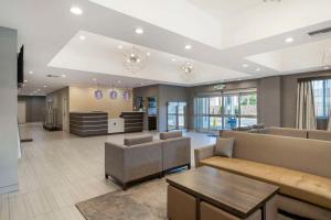 a living room with a couch and a table at Best Western Plus Gardena-Los Angeles Inn & Suites in Gardena