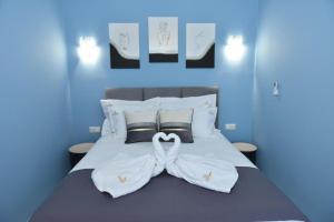 Ένα ή περισσότερα κρεβάτια σε δωμάτιο στο Christianna Apartments by PosarelliVillas +14 φωτογραφίες