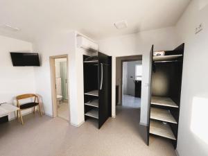 a room with black and white closets at Penzion Vinařská in Polešovice