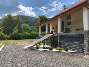 a house with a set of stairs in front of it at Retreat in Svalyava