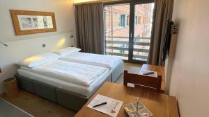 Voodi või voodid majutusasutuse SWISSPEAK Resorts Vercorin toas