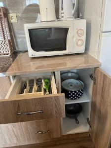 Kuchyň nebo kuchyňský kout v ubytování Apartman KVINS