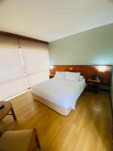 Postel nebo postele na pokoji v ubytování Hotel del Valle Azapa