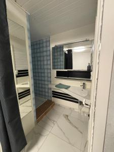 a bathroom with a sink and a mirror at Aimée - Loft in Sanary-sur-Mer