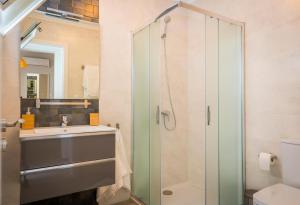 a bathroom with a shower and a sink at Apartment Dolmen de Viera in Antequera +9 photos