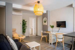 a living room with a couch and a table at Apartment Dolmen de Viera in Antequera