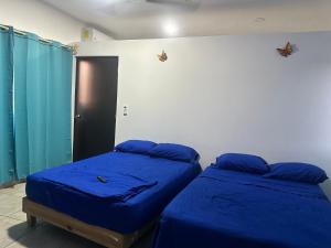 Postel nebo postele na pokoji v ubytování Departamento San José