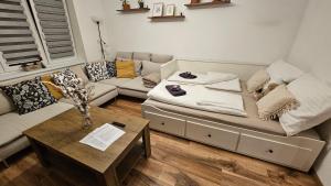 a living room with a couch and a coffee table at KopiHome Liptov in Liptovský Hrádok