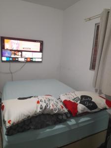 Katil atau katil-katil dalam bilik di Ano Novo Casa pajuçara 300 mts da praia