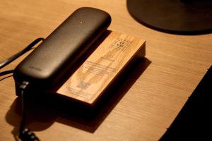 a book sitting on top of a wooden table at 6 VH Hotel in Paris