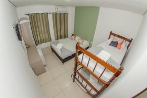 an overhead view of a room with two bunk beds at Pousada 4 Estações in Penha