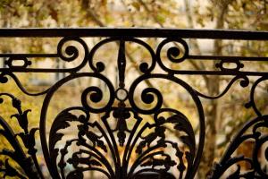a close up of a black wrought iron fence at 6 VH Hotel in Paris