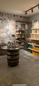 a wine tasting room with a barrel in the middle at le TI-ANOLIS tartane martinique in La Trinité