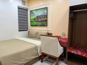 Postel nebo postele na pokoji v ubytování Ha Giang City Hotel