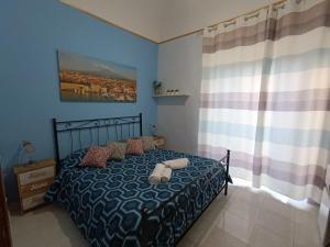 A bed or beds in a room at Casa Emanuele