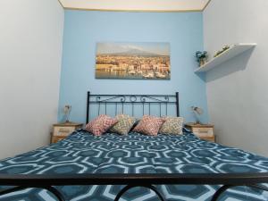 A bed or beds in a room at Casa Emanuele