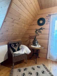 Postel nebo postele na pokoji v ubytování Domek Regionalny Bąkowo Chatka