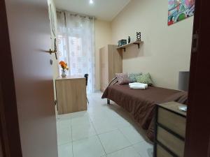 A bed or beds in a room at Casa Emanuele