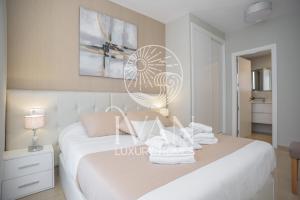 Łóżko lub łóżka w pokoju w obiekcie Casa Maui Ivan Luxury Homes 9ªPta Sur 1ªLínea