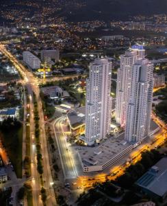 an aerial view of a city at night at Amelie's Apartment 1 in Skopje