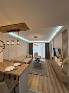 a living room with a couch and a table at Amelie's Apartment 1 in Skopje