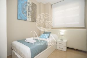 Łóżko lub łóżka w pokoju w obiekcie Casa Maui Ivan Luxury Homes 9ªPta Sur 1ªLínea