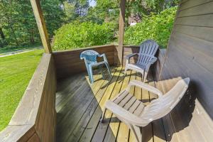 a porch with two chairs and a table and two chairs at Highridge A16 Stunning Three Bedroom Condo with Whirlpool Bath, Heated Pool, and Game Room in Killington